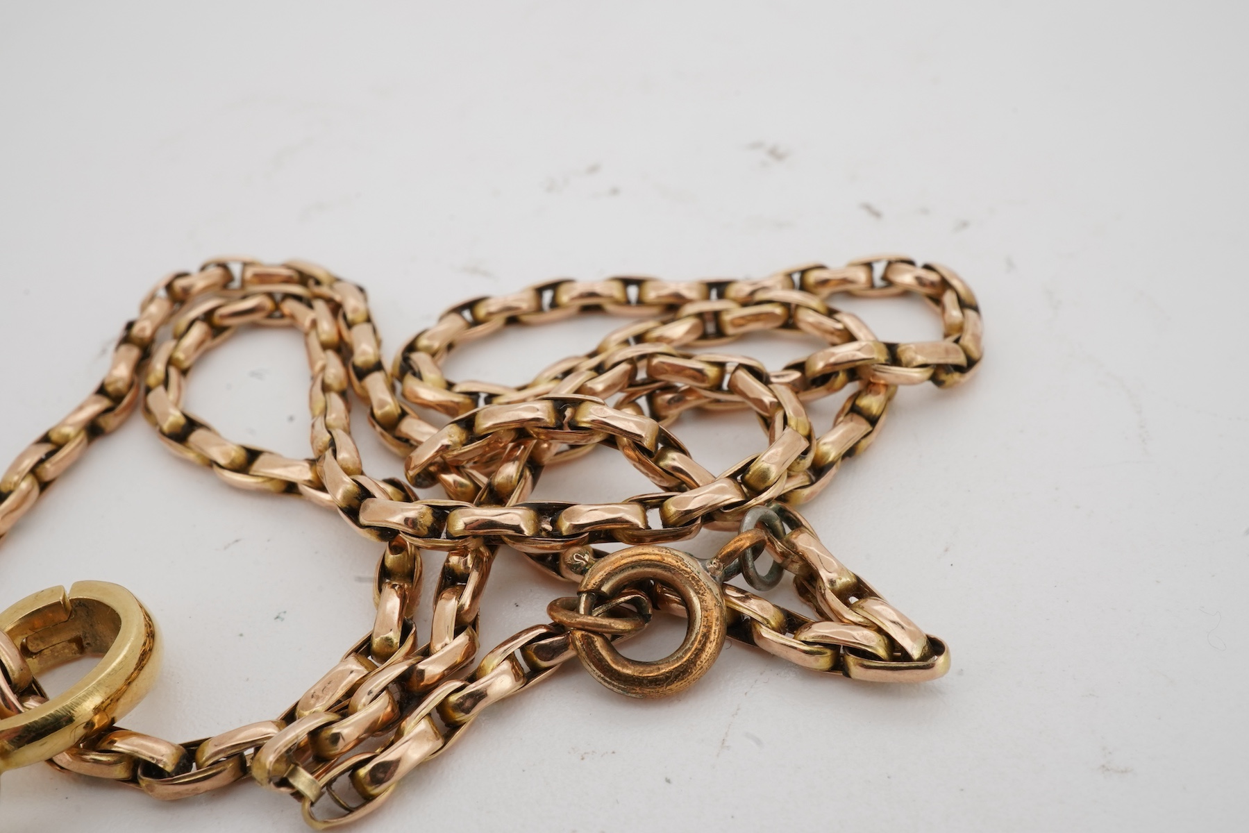 A cultured pearl and diamond demi-parure, comprising: a pendant, suspending a drop-shaped cultured pearl of black tint, measuring approximately 15 x 10.5 x 10.5mm, surmounted by a collet-set brilliant-cut diamond weighin